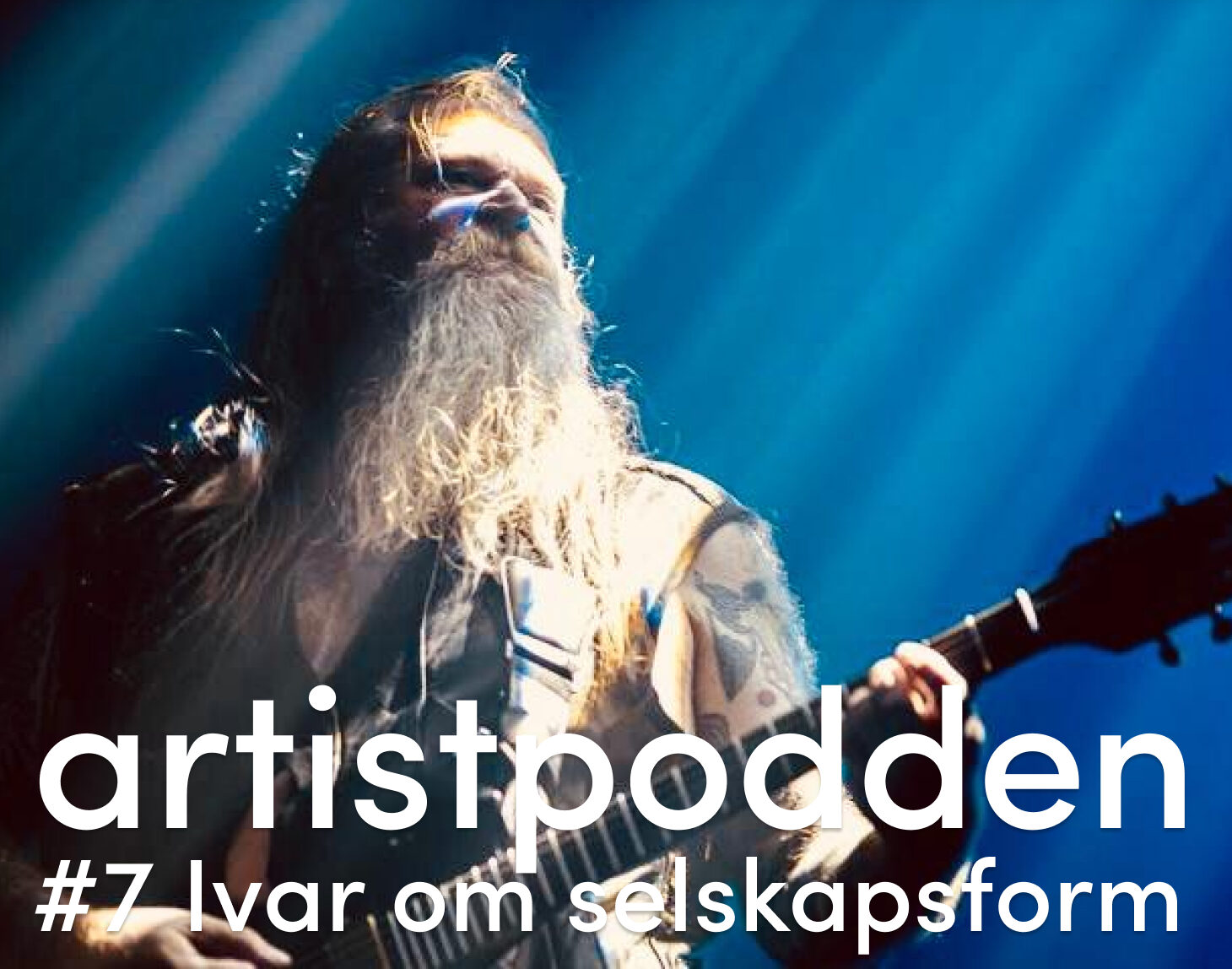 skjeggete mann med gitar