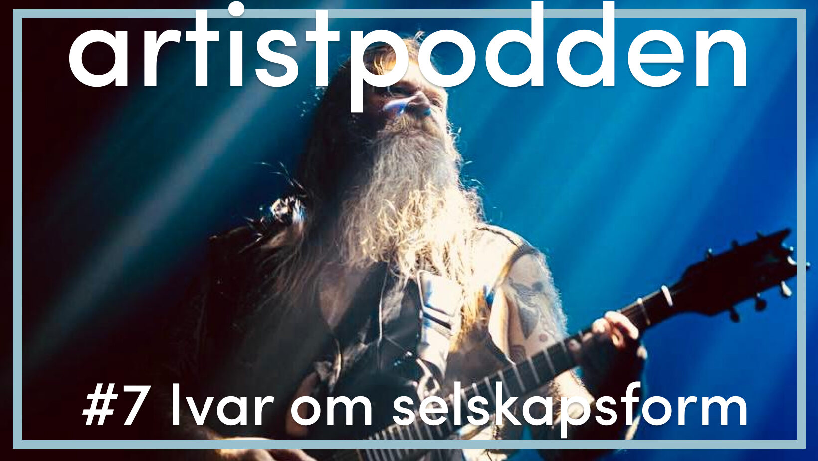skjeggete mann med gitar